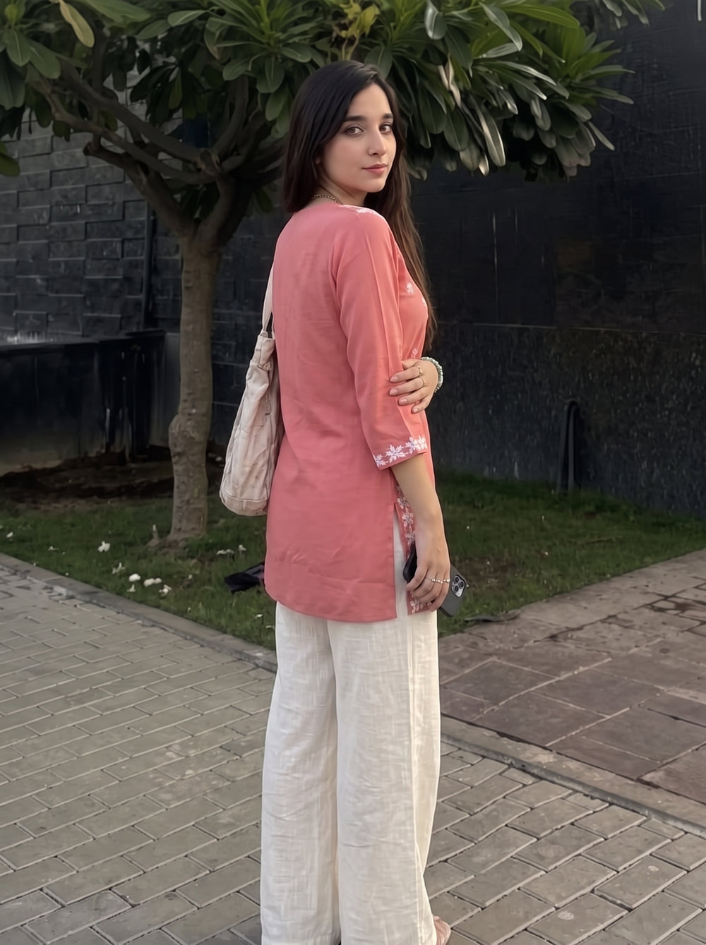 Sara Peach Embroidered Top over-shoulder styled view – The Suitable